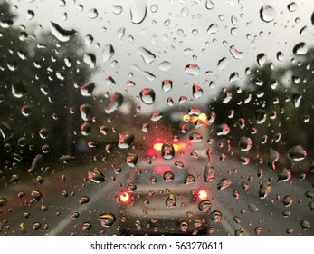 Raining Day Trough The Car Windows In Malaysia Road During Monsoon