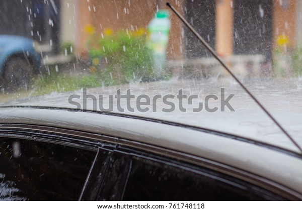 raining on the roof of the\
car