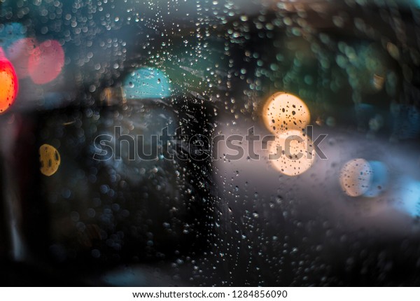 Raining outside the\
car, bokeh and\
raindrops