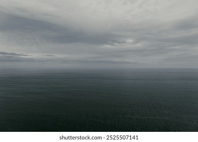 Raining sky over the Atlantic Ocean, Tenerife. Minimalism. Misty morning in the sea. Calm view. Tranquil empty landscape with soft blue gray sky. Natural gloomy weather. - Powered by Shutterstock