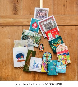 Rainow,UK - December 10th 2015:Christmas Card Display Hanging On An Old Traditional Wooden Door.  