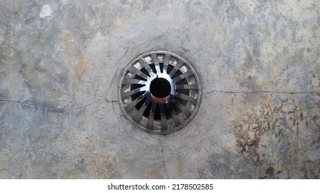 A Rainwater Drain Hole On The Roof That Is Slightly Cracked