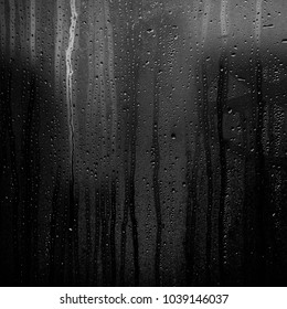 Rainy Background With Flowing Down Water Drops On Window Glass