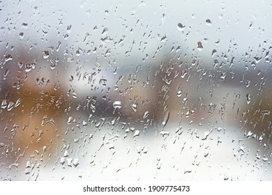 Rainy City Background. Raindrops On Window Glass. Wet Home Window With Raindrops.