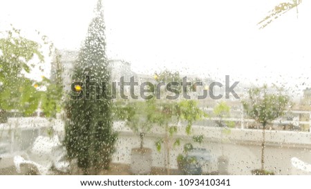 Similar – Rainy day I View through a wet window pane onto a busy street