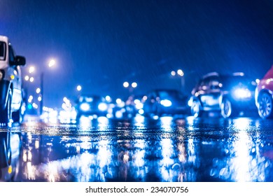 Rainy Day In The City At Night, Stream Of Cars On The Road