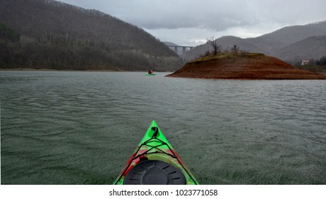 Rainy Day With Kayak On The Lake