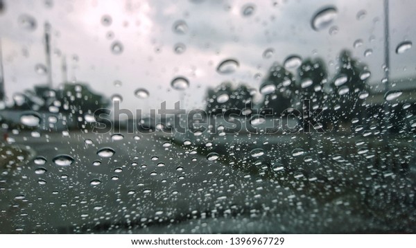 rainy day on the road , rain falling make car stop\
and slowly