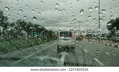 Rainy day view through the car. Traffic jam. Selective focus. 