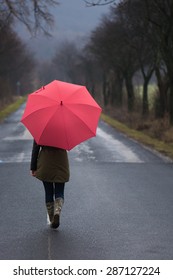 Rainy Day Woman Holding Red Umbrella