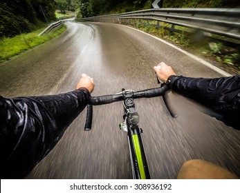 Rainy Day,man On Road Bike. POV, Original Point Of View. 