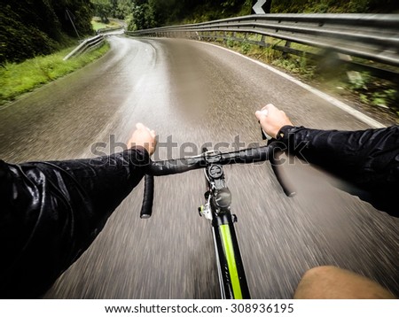 rainy day,man on road bike. POV, Original Point of View. HDR effects.