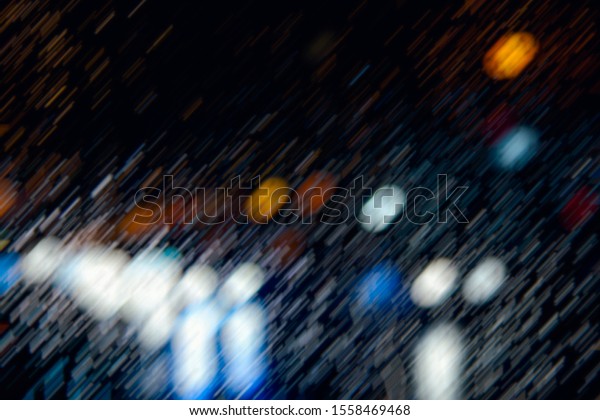rainy night,\
heavy rain falling and night traffic\
