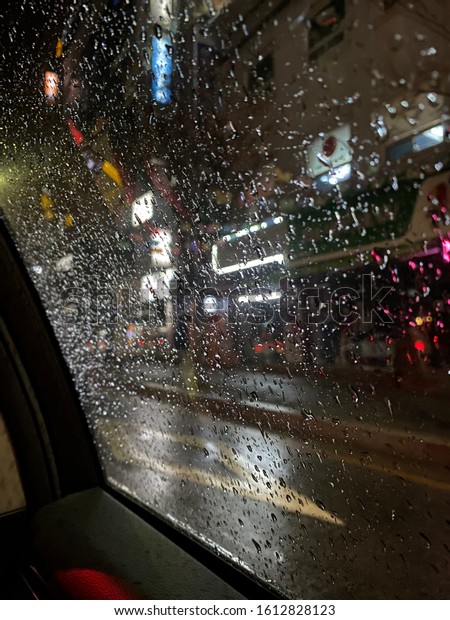 Rainy night. View in the\
car.