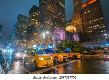 Rainy Weather On 50th Street And Park Avenue, Wet Yellow Taxi Cars Stop At A Red Light At Night, Manhattan, New York City, 10022, United States Of America. 12.18.2021