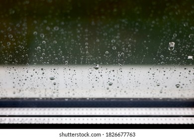 Rainy Window With Drops With A Window Sill In The Background