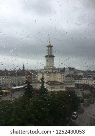 Rainy window with monastery on background.