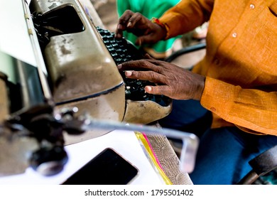 Raipur, Chhattisgarh, India/ October 25, 2019: A Typist Using Vintage Typewriter For Typing Legal Document. 