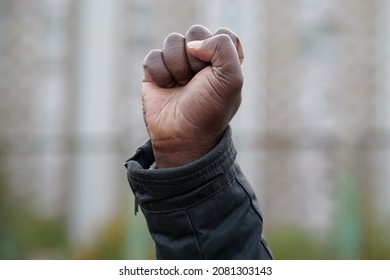 Raised Black Man Fist In Protest. Fist Of African American, Social Justice And Peaceful Protesting Racial Injustice. Black Lives Matter, BLM. Mass Protests Against Racism In USA