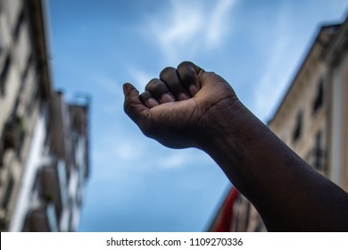The Raised Fist.
A Black Man Raises His Fist To The Sky During A Migrants Protest Against Racial Discrimation. Black Power, Revolution. Black Lives Matter