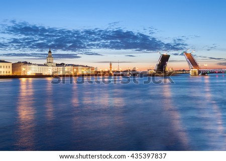 The raised Palace bridge at white nights in the city of St.-Petersburg