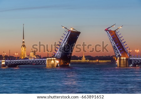 The raised Palace bridge at white nights in the city of St.-Petersburg
