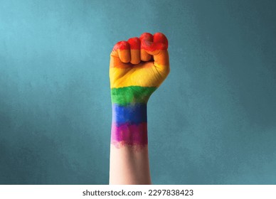 Raised rainbow fist of a woman for PRIDE month and the LGBTQIA+ movement. Pride day for sexuality freedom, love diversity celebration and the fight for human rights