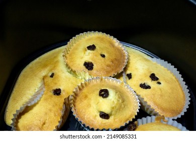 Raisin Vanilla  Chocolate Chip Muffin Disaster. It Over Paper Cups. Homemade Bake By Hot Air Fryer.