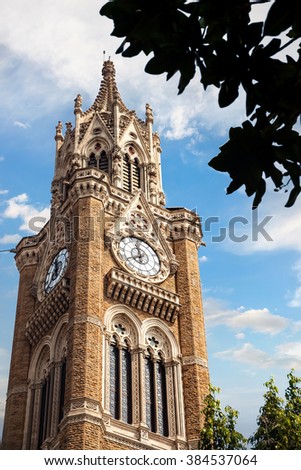Rajabai Clock Tower at blue cloudy sky background in Mumbai, India