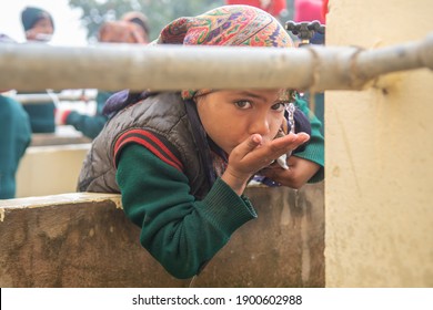 Rajasthan. India. 07-02-2018. Beautiful Portrait Of A Girl Drinking Water At School.