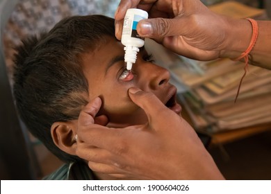 Rajasthan. India. 07-02-2018. Child Receiving Medical Attention By Doctor For A Problem With His Eyes.