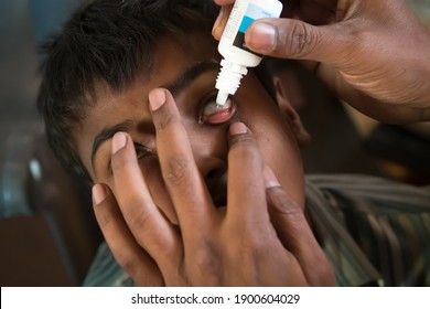 Rajasthan. India. 07-02-2018. Child Receiving Medical Attention By Doctor For A Problem With His Eyes.