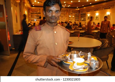 Rajasthan, India - February 26, 2006: Motion Blur Image Of A Waiter With Tray And Blurred Background Of A Downtown Restaurant In The City Of Jaipur