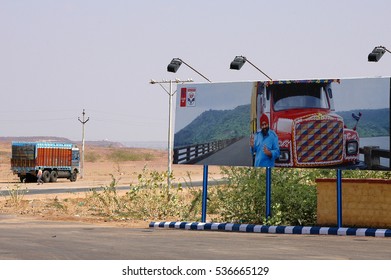  RAJASTHAN , INDIA - MARCH 11, 2006: Advertising Billboard On A Modern Highway With A Transport Truck And Real Truck In The Background