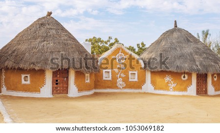 Rajasthan village near Thar desert Jaisalmer with mud huts and painted walls