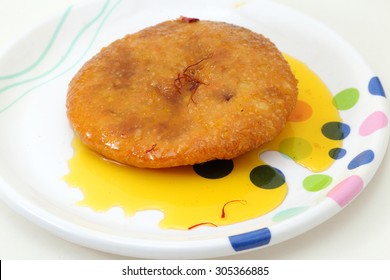 Rajasthani Shahi Mawa Kachori, Stuffed Katchori With Condensed Milk, Cheese And Dry Fruits And Served With Sugar Syrup.