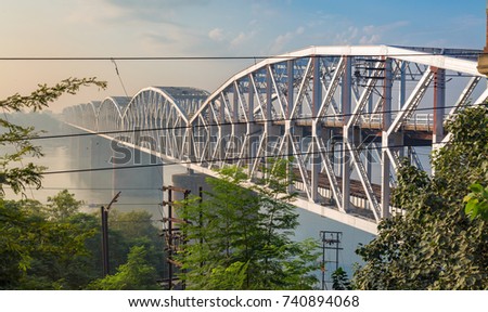 Rajghat bridge on the river Ganges at sunrise. Also known as the Malviya bridge it is a double decker bridge with rail tracks on the lower tier and vehicle road on the upper tier.