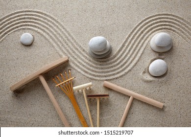 A Rake In A Zen Rock Garden, Preparing The Sand. Top View