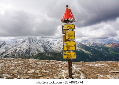 Rakon, Western Tatra Mountains - September 20, 2019: Mountain Trail Sign Pointing Direction On Wooden Pole