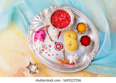 Raksha Bandhan Raakhi Thali With Sweets Gifts Flowers And Diya