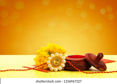Raksha Bandhan Rakhi With Flower And Kumkum