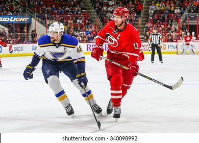 RALEIGH, NC January 30, 2015: St. Louis Blues center David Backes (42) and Carolina Hurricanes center Eric Staal (12) during the NHL game between the St Louis Blues and the Carolina Hurricanes.