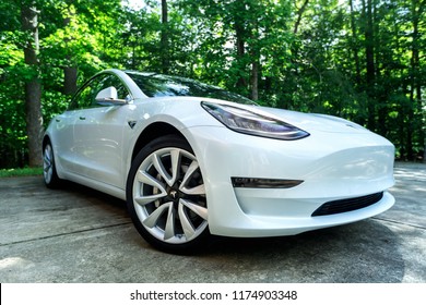 RALEIGH, NC - JULY 08, 2018: An all electric Tesla Model 3 in Raleigh, NC. The Model 3 is set to be the Tesla's first mass market electric vehicle.