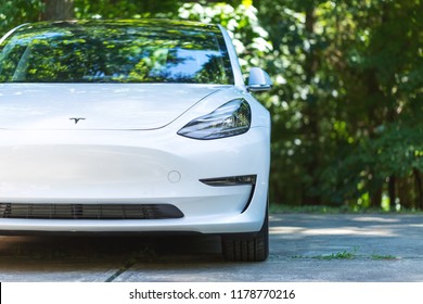 RALEIGH, NC - JULY 08, 2018: An all electric Tesla Model 3 in Raleigh, NC. The Model 3 is set to be the Tesla's first mass market electric vehicle.