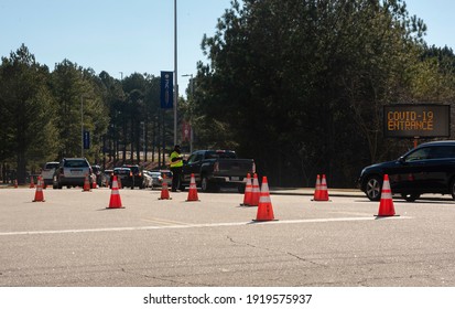 Raleigh, NC - United States- 02-17-2021: Vehicles Line Up For A Mass Vaccine Event At PNC Arena By Appointment Only.