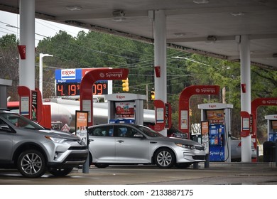 Raleigh, NC - United States- 03-09-2022: Vehicles At An Exxon Fill Up Amongst Historic Gas Prices In North Carolina. 