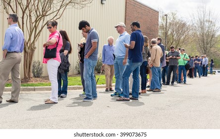 RALEIGH, NC USA. MARCH 31 2016: People Waiting In Line At A Tesla Motors Location To Reserve A New Tesla Model III.
