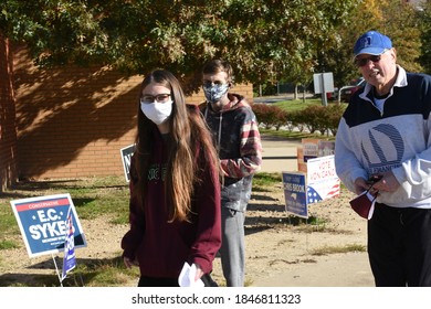 Raleigh, NC/United States- 11/03/2020: 2 First Time Voters Walk To The Polls With Their Father On Election Day. 