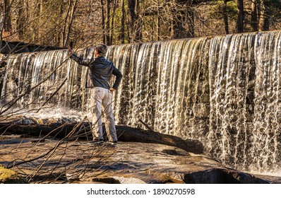 Raleigh, North Carolina USA-01 09 2021: A Man Takes A Selfie At Yates Mill In Winter.