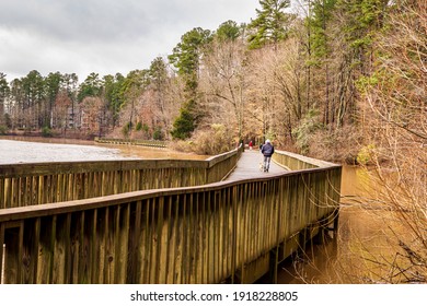 Raleigh, North Carolina USA-02 16 2021: Walking On The Lake Lynn Boardwalk On A Winter Morning.